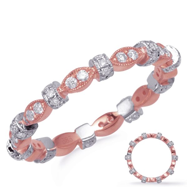 A rose gold and silver ring featuring an entwined design with clear gemstones.