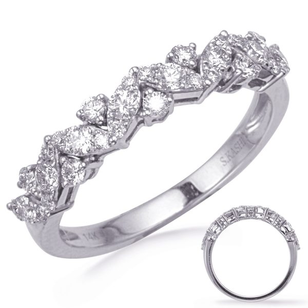 A silver ring is adorned with multiple sparkling diamonds arranged in a twisting pattern.