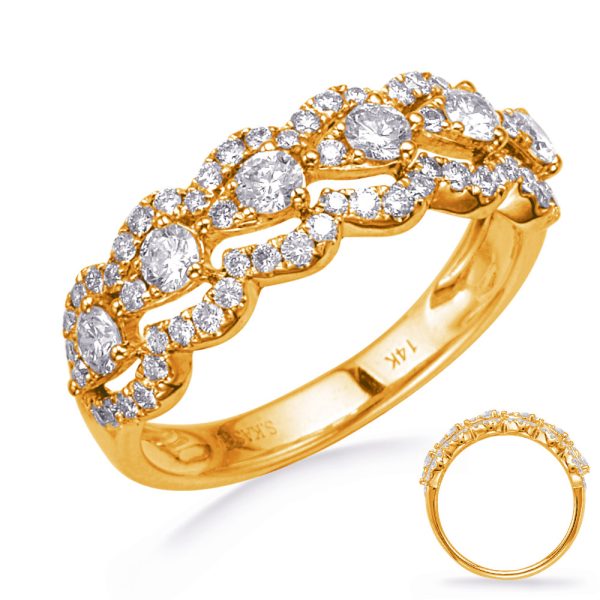 A gold ring featuring a wavy design adorned with multiple sparkling diamonds.