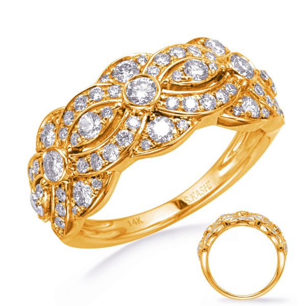A gold ring with intricate designs features multiple sparkling diamonds arranged in a floral pattern.