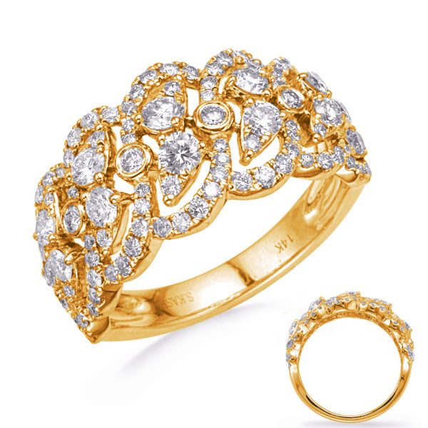 A gold ring adorned with multiple sparkling diamonds in an intricate design is prominently displayed on a white background.