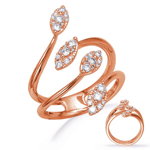 Rose gold ring with a twisted design featuring multiple shimmering diamond-like stones.