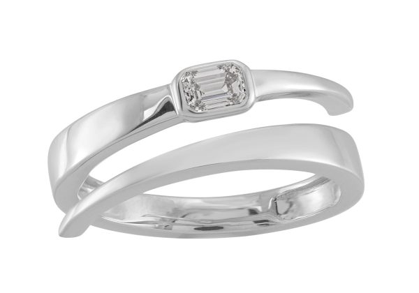 A silver ring features a central rectangular stone set within an elegant twisted band design.