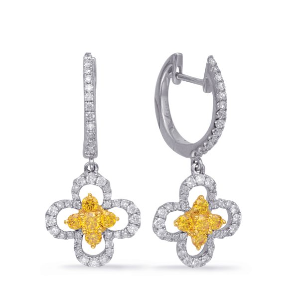 Yellow gemstone floral earrings with diamond accents on a silver setting.