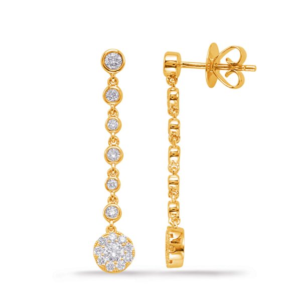 Gold drop earrings featuring multiple round stones along a chain, with a larger stone at the bottom.