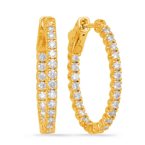 Gold hoop earrings adorned with multiple sparkling diamonds are displayed side by side.