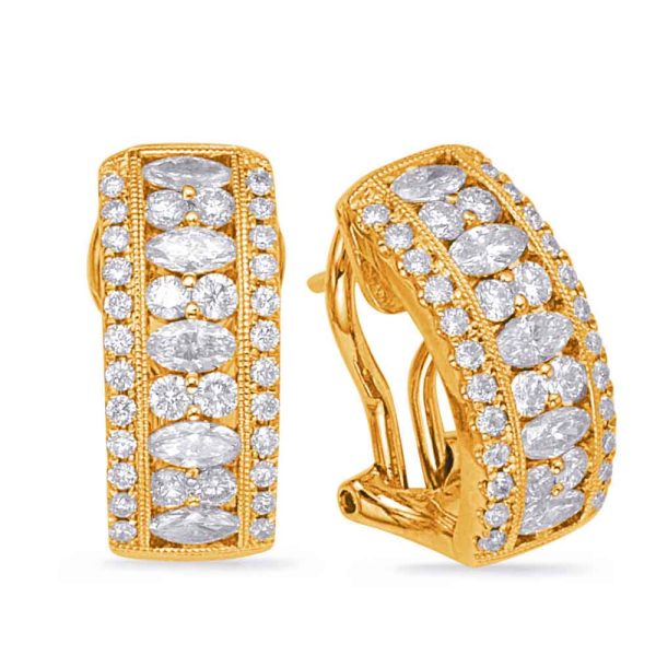 Gold hoop earrings are displayed with a series of oval and round clear stones embedded along the front.