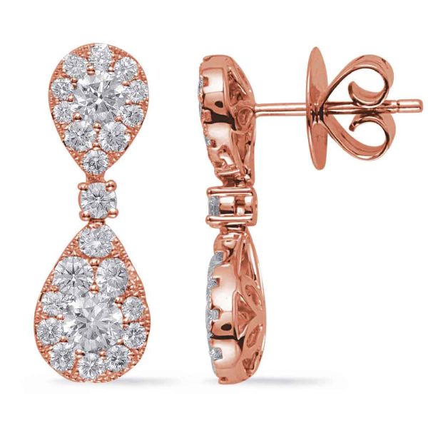 Rose gold earrings with a teardrop design are displayed, featuring multiple sparkling gemstones.