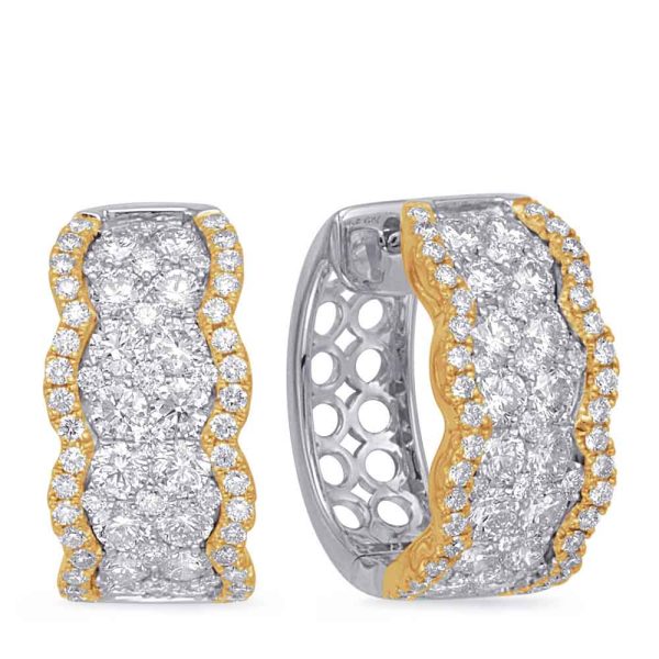 A pair of gold and silver hoop earrings embellished with diamonds is displayed side by side.