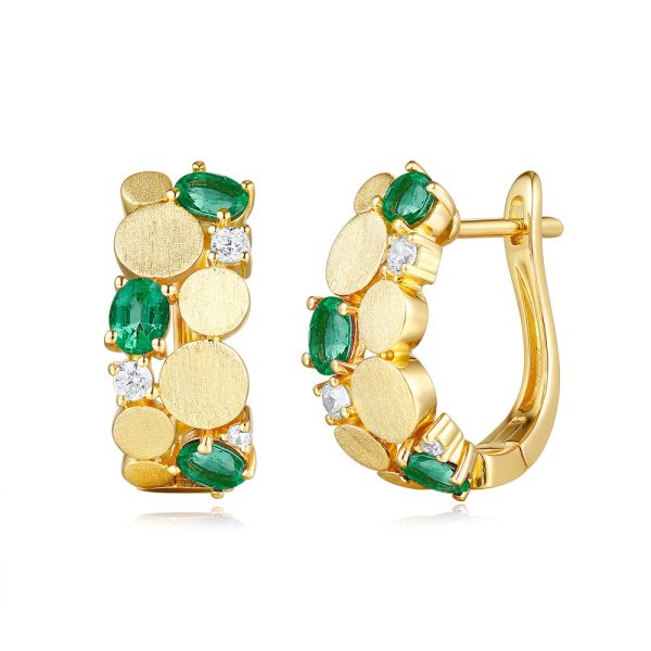 Gold hoop earrings featuring green and clear gemstones arranged in a decorative pattern.