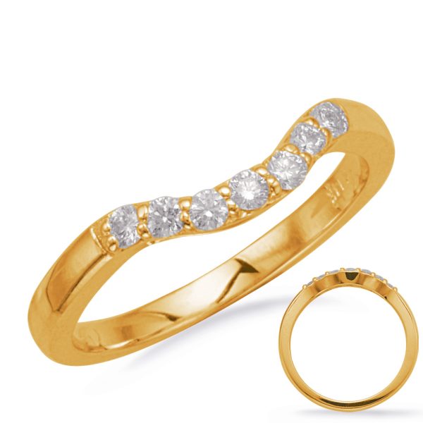 Gold ring with five round diamonds set in a wavy design.