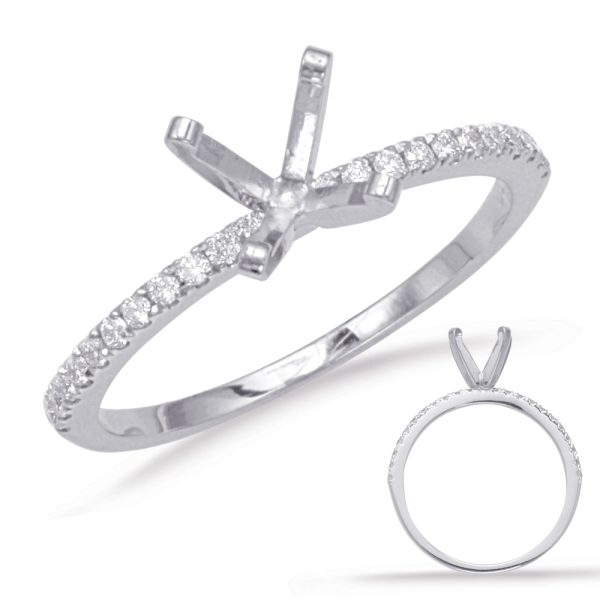 A silver ring with a group of small diamonds on the band and a prominent setting for a central stone.