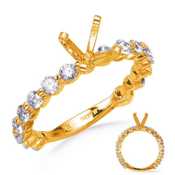 A gold ring with multiple gemstones arranged in a circular design is displayed prominently with a smaller image showing a similar view.