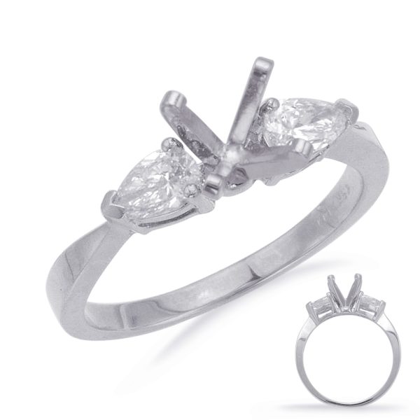 A silver ring featuring two pear-shaped clear gemstones prominently displayed on its band.