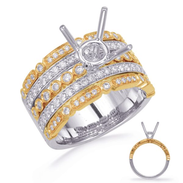 A gold and silver ring with multiple rows of diamonds features a central prong setting for a stone.