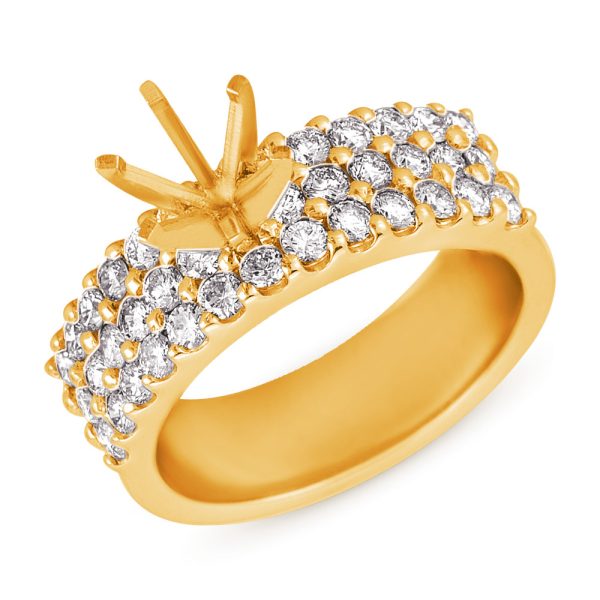 A gold ring adorned with numerous small diamonds and a prong setting for a larger stone is displayed.