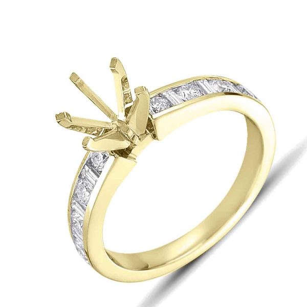 A yellow gold engagement ring features a raised prong setting for a center stone and a channel of smaller clear stones along the band.