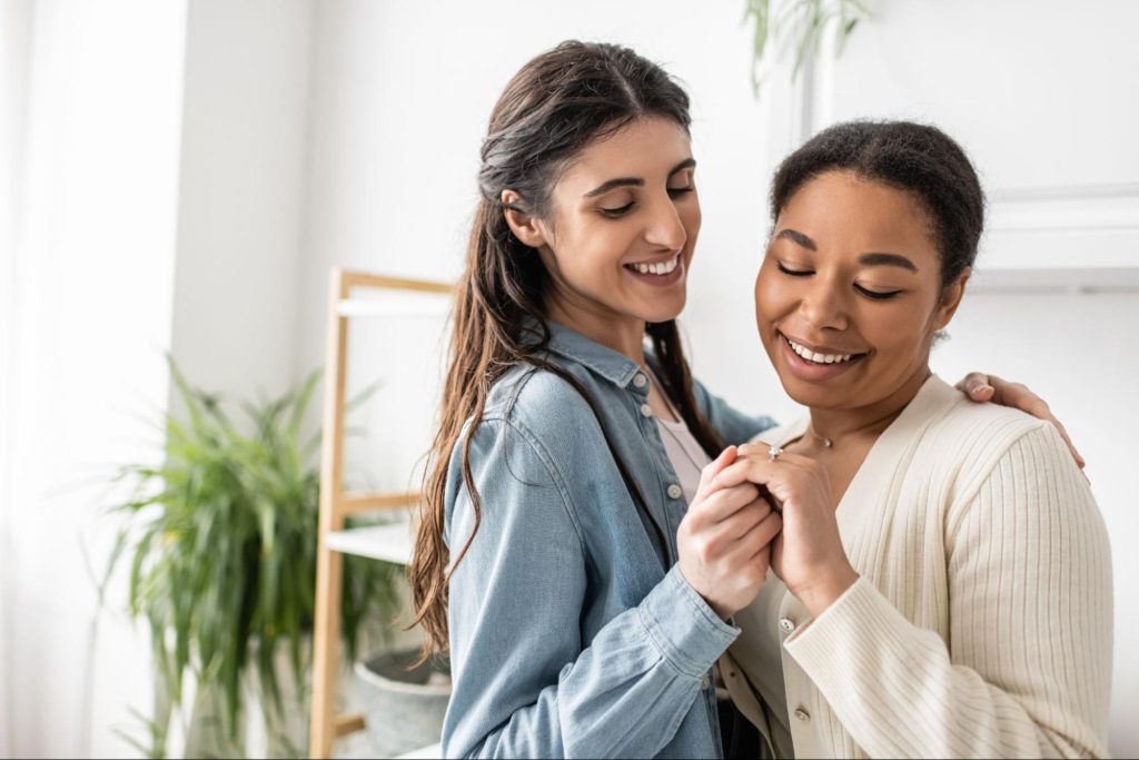 A couple looking at their engagement ring